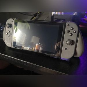 Gray Nintendo Switch with accessories